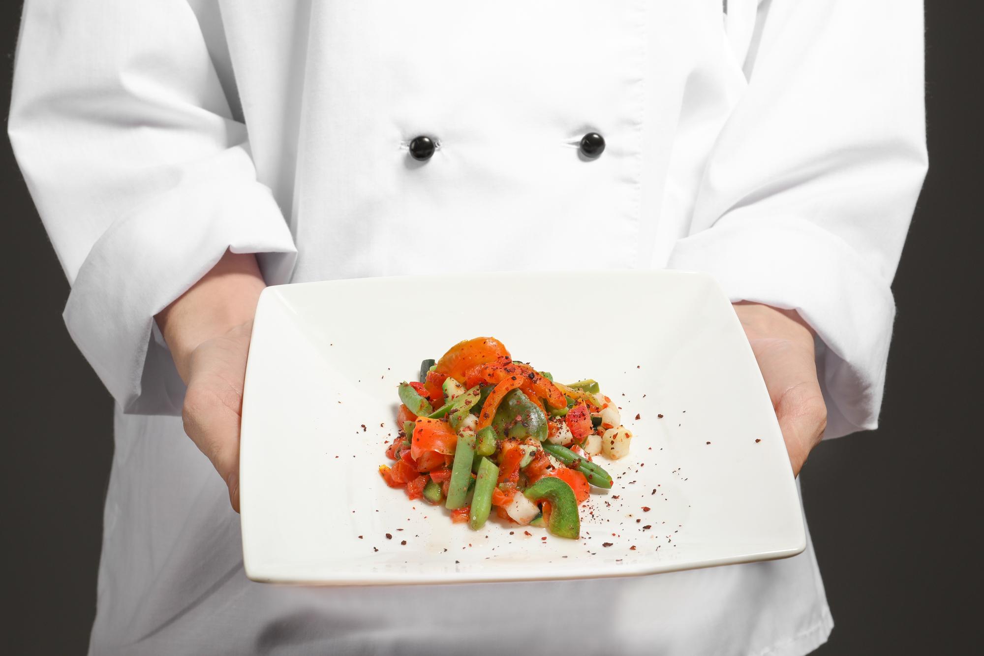 Chef teaching online workshop with hands-on plating